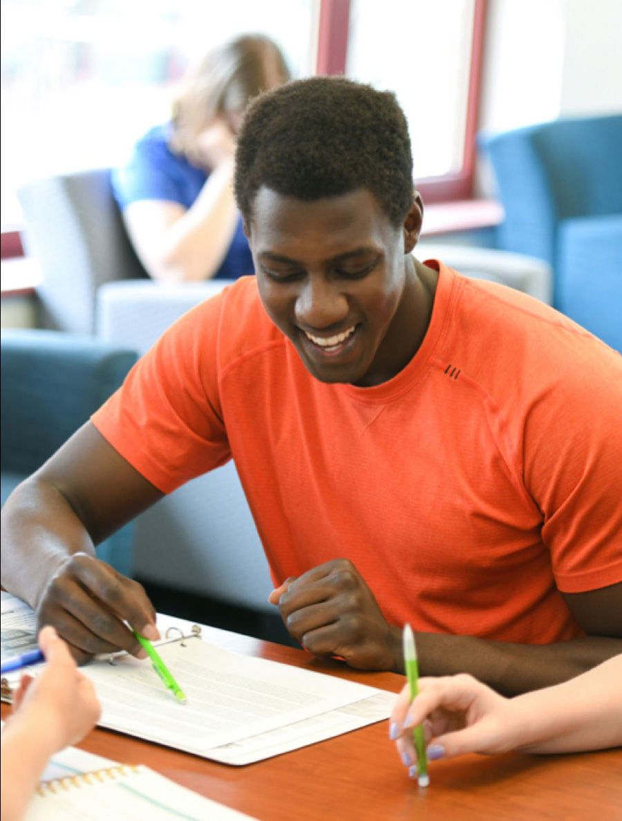 Male student working on a group project.