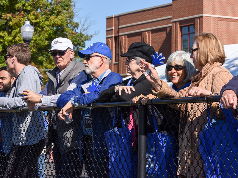Alumni watching the football game.